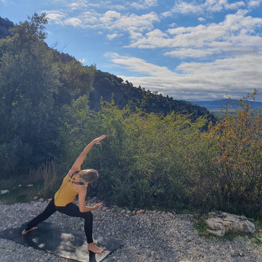 Zoe doing yoga abroad in France whilst staying in the campervan