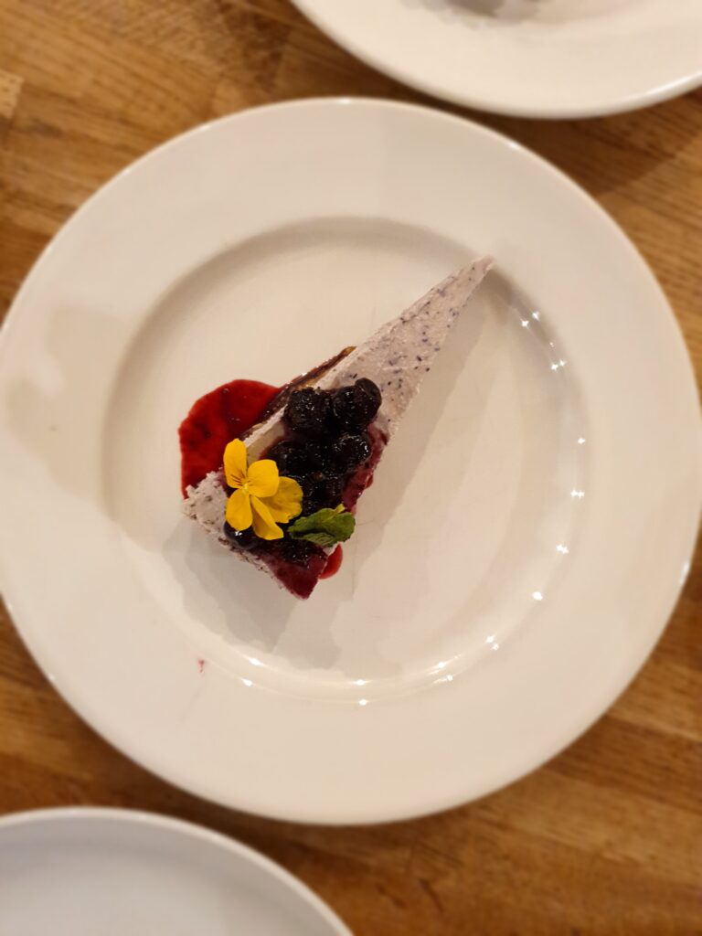 vegan gluten free blueberry cheesecake with blueberry and mint compote