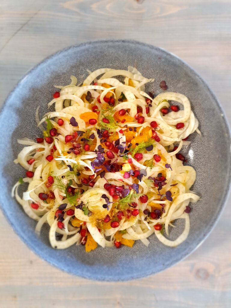 Ayurvedic shaved fennel, blood orange and pomegranate salad with ginger dressing and homegrown microherbs